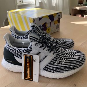 Adidas ultra boosts in black and white.